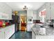 A well-lit kitchen features white cabinets and granite countertops with an adjacent room at 701 4Th Ne Ave, Conover, NC 28613