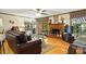 Living room with hardwood floors, brick fireplace, and comfortable seating area at 701 4Th Ne Ave, Conover, NC 28613