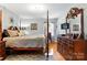 Main bedroom with a four-poster bed and hardwood floors at 701 4Th Ne Ave, Conover, NC 28613