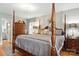 Main bedroom featuring a four-poster bed and hardwood floors at 701 4Th Ne Ave, Conover, NC 28613