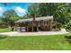 Brick house features a rear deck and garage with ample parking space at 701 4Th Ne Ave, Conover, NC 28613