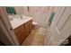 Cozy bathroom featuring a floral shower curtain and tile flooring at 729 Victoria Ln, Hickory, NC 28601
