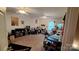 Expansive bonus room with neutral carpet, various musical instruments, ceiling fan, and natural light at 729 Victoria Ln, Hickory, NC 28601