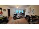 Open bonus room offers ample space, natural light, neutral carpet, ceiling fan, and door to bathroom at 729 Victoria Ln, Hickory, NC 28601