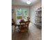 Dining area with a wood table, chairs, and sliding glass doors leading to a deck at 729 Victoria Ln, Hickory, NC 28601