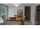 Inviting dining area with wood table set, storage closet, and slider access to the outdoor deck at 729 Victoria Ln, Hickory, NC 28601