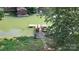 The backyard dock overlooks the serene green lake with a wooden house at 729 Victoria Ln, Hickory, NC 28601