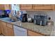 The kitchen counter has wood cabinets, granite counters, and stainless steel appliances at 729 Victoria Ln, Hickory, NC 28601
