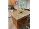 Kitchen island with granite countertop and seating, ideal for food preparation and casual dining at 729 Victoria Ln, Hickory, NC 28601