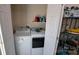 Bright laundry room with a washer and dryer, plus extra shelf space at 729 Victoria Ln, Hickory, NC 28601