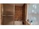 Bathroom features a glass shower, corner jacuzzi tub, privacy window, and a warm color palette at 729 Victoria Ln, Hickory, NC 28601