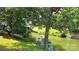 Lush landscaping surrounds this waterfront property with a wooden dock at 729 Victoria Ln, Hickory, NC 28601