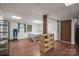 The basement features a comfortable layout and wood laminate flooring at 742 Stonecrest Dr, Statesville, NC 28625