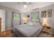 Cozy bedroom with hardwood floors, natural lighting, neutral walls, and classic decor at 742 Stonecrest Dr, Statesville, NC 28625