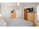 Bedroom featuring wood floors, a ceiling fan, dresser, and closet for storage at 742 Stonecrest Dr, Statesville, NC 28625