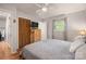 Bedroom with wood floors, a ceiling fan, closet, dresser, and natural light at 742 Stonecrest Dr, Statesville, NC 28625