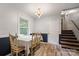 Inviting dining room featuring a table, a window with natural light, and a staircase at 742 Stonecrest Dr, Statesville, NC 28625