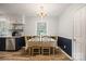 Bright dining area with a table set for four, complemented by modern lighting at 742 Stonecrest Dr, Statesville, NC 28625