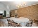 The dining area features a brick accent wall and wood floors at 742 Stonecrest Dr, Statesville, NC 28625