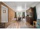 The dining room features a vintage feel with beautiful brick wall and wood floors at 742 Stonecrest Dr, Statesville, NC 28625