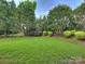 Expansive backyard showcasing a well-maintained lawn and attractive landscaping at 901 Deercross Ln, Waxhaw, NC 28173