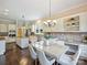 Bright and inviting dining area connected to a gourmet kitchen with stainless appliances and custom cabinetry at 901 Deercross Ln, Waxhaw, NC 28173