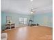Spacious home gym featuring wood floors, a large window, and a treadmill at 901 Deercross Ln, Waxhaw, NC 28173