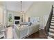 Bright living room featuring a fireplace, vaulted ceiling, and a comfortable seating arrangement at 901 Deercross Ln, Waxhaw, NC 28173