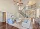 Spacious living room featuring a staircase, comfortable seating, and lots of natural light at 901 Deercross Ln, Waxhaw, NC 28173