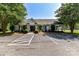 Community clubhouse featuring professional landscaping, designated parking, and mature trees at 9029 Torrence Crossing Dr, Huntersville, NC 28078