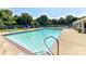 Enjoy this sparkling community pool with lounge chairs, umbrellas, and mature trees at 9029 Torrence Crossing Dr, Huntersville, NC 28078