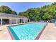Enjoy this community pool with crystal blue water, lounge chairs, umbrellas, and nearby shade at 9029 Torrence Crossing Dr, Huntersville, NC 28078