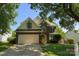 Charming two-story brick home with a well-manicured lawn and a two-car garage at 9029 Torrence Crossing Dr, Huntersville, NC 28078