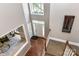Bright foyer with hardwood floors, high ceilings, and a view of the living room at 9029 Torrence Crossing Dr, Huntersville, NC 28078