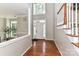 Bright foyer with a high ceiling, hardwood floors, and natural light from the front door at 9029 Torrence Crossing Dr, Huntersville, NC 28078