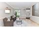 Neutral living area with tile floors, updated fixtures, and a bright front entrance at 9029 Torrence Crossing Dr, Huntersville, NC 28078