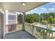Relaxing view from a private balcony overlooking the community pool and lush greenery at 9271 Meadow Vista Rd, Charlotte, NC 28213