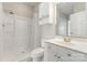 This bathroom features white tile and a modern shower and vanity at 9271 Meadow Vista Rd, Charlotte, NC 28213