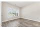 This bedroom has wood flooring and a window letting in natural light at 9271 Meadow Vista Rd, Charlotte, NC 28213