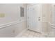 Tiled foyer with the front door and electrical panel at 9271 Meadow Vista Rd, Charlotte, NC 28213