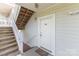 Inviting condo entrance featuring a welcome mat, stairs, and an easy-to-locate unit number at 9271 Meadow Vista Rd, Charlotte, NC 28213