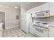 Functional kitchen with white appliances and plenty of counter space for meal prep at 9271 Meadow Vista Rd, Charlotte, NC 28213