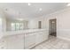 Bright kitchen features white cabinets, tile floors, and modern dishwasher at 9271 Meadow Vista Rd, Charlotte, NC 28213