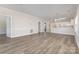 Inviting living room that opens into the kitchen, with hardwood floors and neutral paint at 9271 Meadow Vista Rd, Charlotte, NC 28213