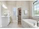Bathroom featuring a tub, vanity with drawers, and lots of natural light at 1011 Duntov Dr, Monroe, NC 28110