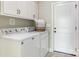 Laundry room with a washer, dryer, and upper cabinets at 1011 Duntov Dr, Monroe, NC 28110