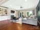 Spacious living room with hardwood floors, fireplace, and access to the outdoors at 1011 Duntov Dr, Monroe, NC 28110