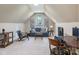 Cozy room featuring a blue sofa, chess table, and neutral carpet, creating an inviting living space at 1011 Duntov Dr, Monroe, NC 28110