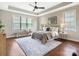 Bedroom with a tray ceiling, ceiling fan, area rug, and natural light at 1011 Duntov Dr, Monroe, NC 28110