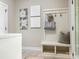 Mudroom with a built-in bench, hooks, and storage space at 1011 Duntov Dr, Monroe, NC 28110